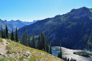 Trees, mountains, and alpine lake