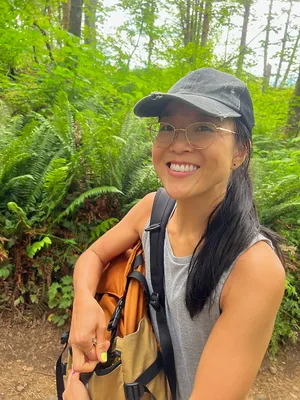 Woman hiking among ferns