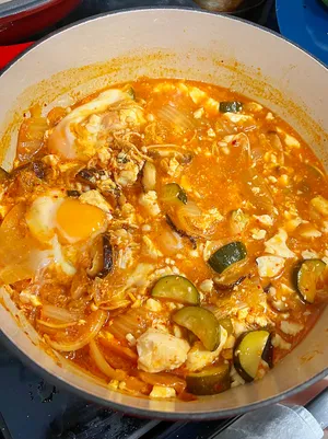 A crock pot full of kimchi jjigae