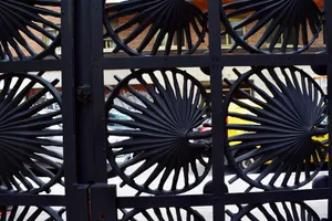 Black iron gate with mollusc shapes