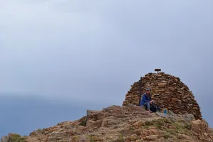 Woman at summit of Pic Casamanya in the fog