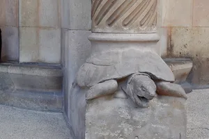 Column plinth of a turtle with its mouth open