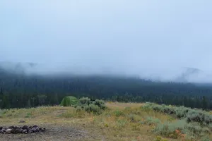 Low fog over a mountain campsite