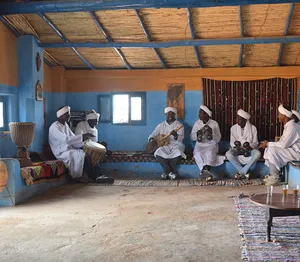 Musicians in a desert hut