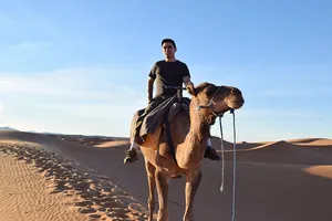 Man on a camel in Erg Chebbi