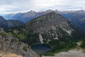 Mountain peaks above alpine lake