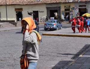 Woman in an orange head scarf