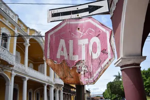 A peeling and bent alto sign