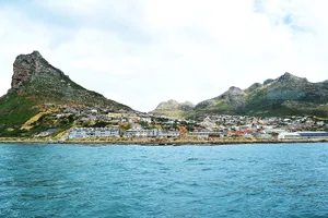 City and rock formations seen from a boat