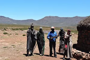 Covered Sotho men and an instrument