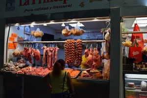 Meat hanging at the market at night