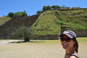 Woman in front of Zapotec pyramid steps