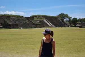 Woman in front of Monte Alban pyramids