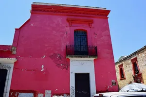 Bright pink colonial building